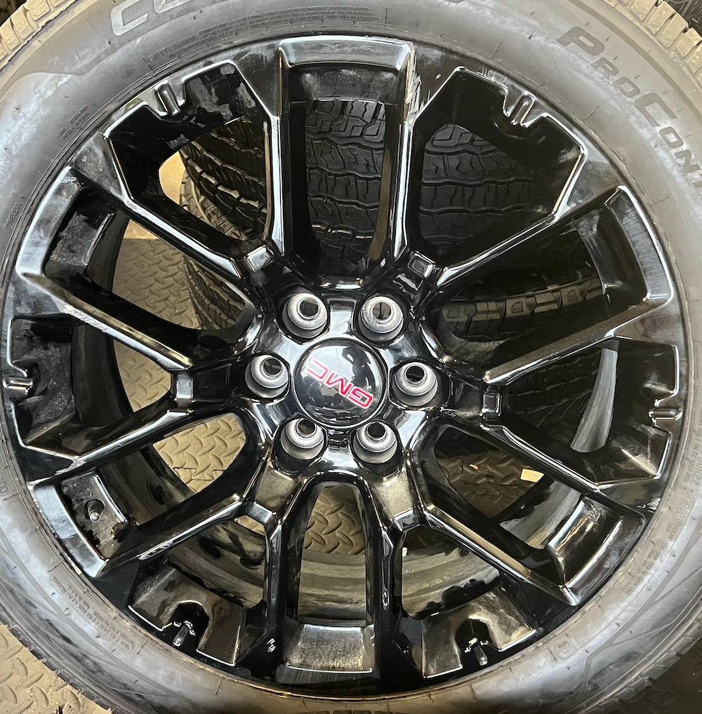 OEM 22” Gloss Black Chevrolet Wheels wrapped in Cooper ProControl tires.