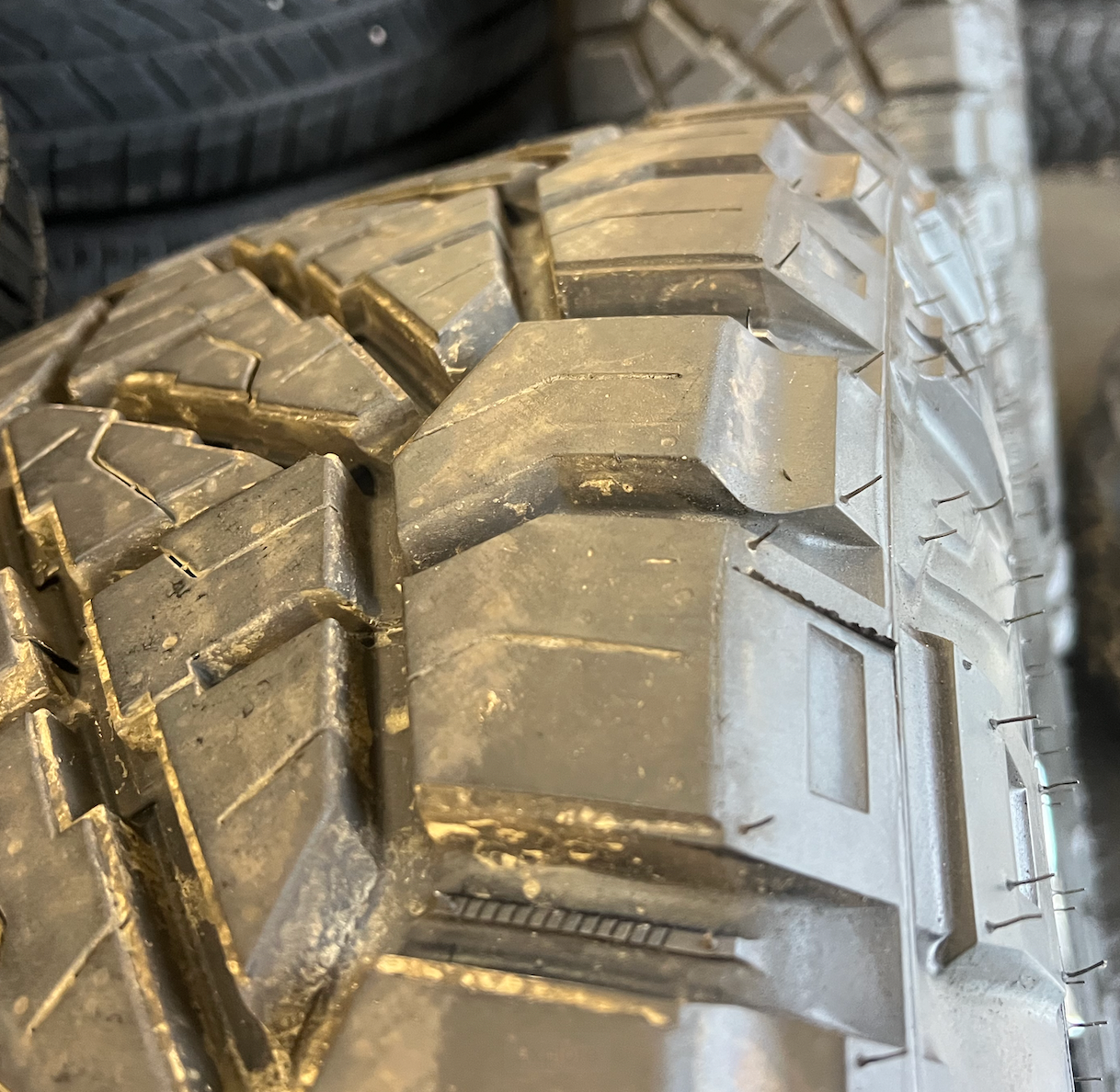 OEM 20” Chrome Truck Wheels wrapped in Nitto Ridge Grappler tires.