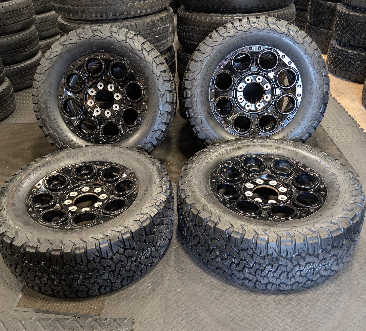 OEM 20” Gloss Black Ford F-250 / F-350 Tremor Lariat BAP Wheels wrapped in 35x12.50R20LT BFGoodrich All-Terrain T/A tires.