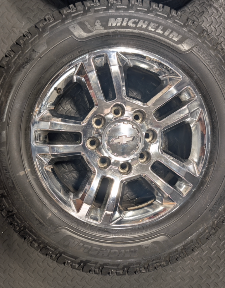 Chrome GM 2500HD / 3500HD OEM 20” Wrapped in Michelin Defender LTX