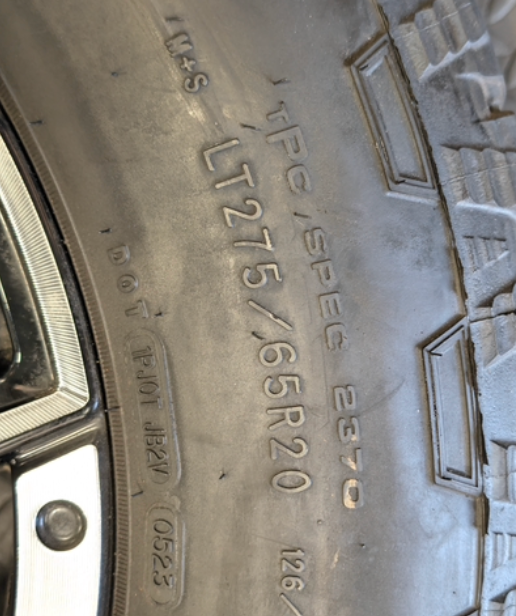 OEM 20” Machined GM 2500HD / 3500HD Wheels wrapped in Goodyear Wrangler TrailRunner A/T tires.