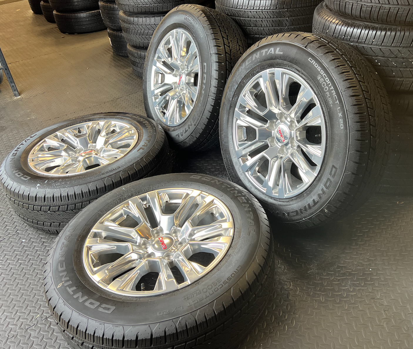OEM 20” Polished Wheels wrapped in 20” Continental tires.