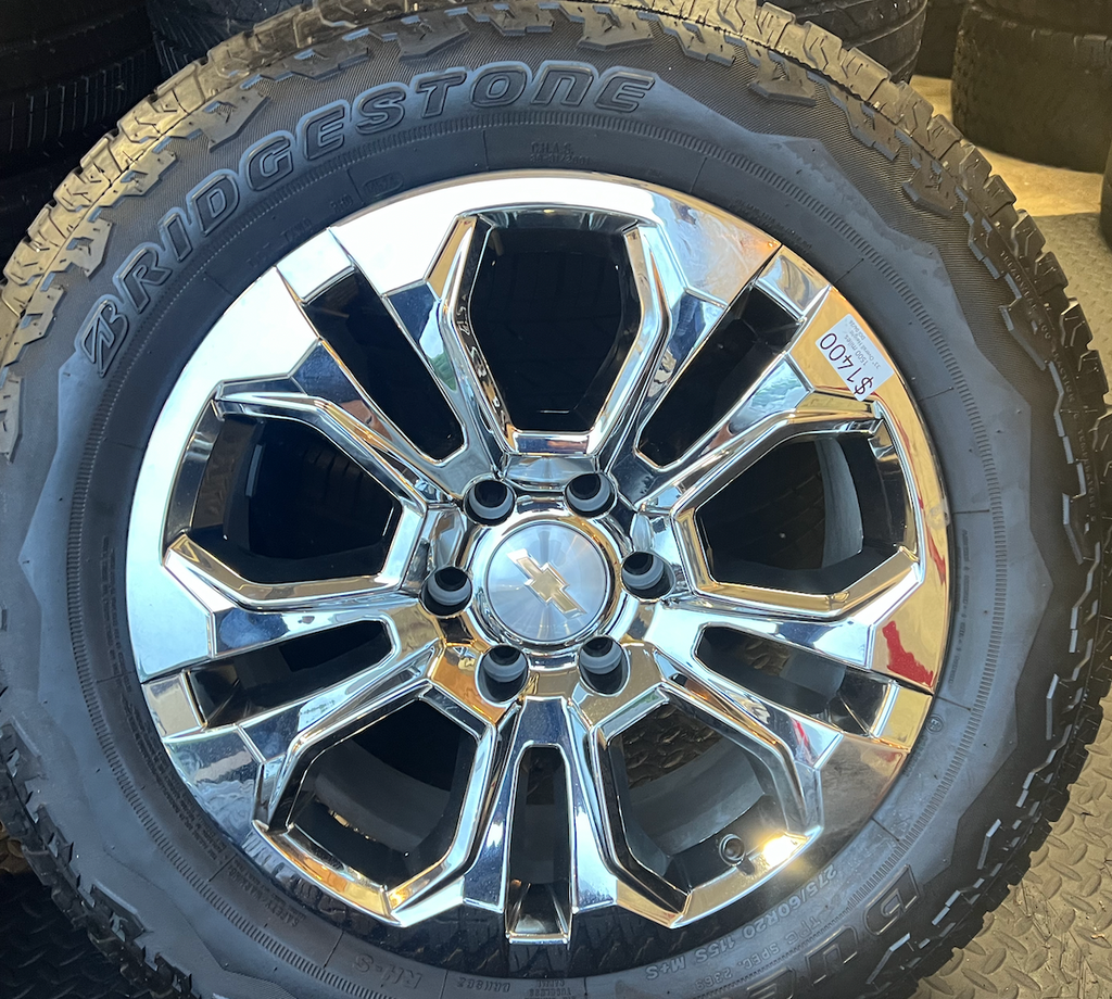 OEM 20” Chrome Wheels wrapped in Bridgestone Dueler tires.