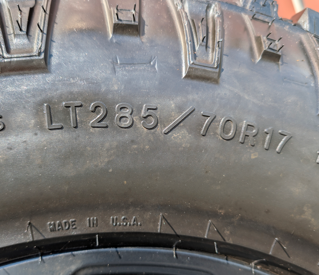 Matte Black Ram 2500 Power Wagon OEM 17” Wrapped in Goodyear Wrangler DuraTrac LT285/70R17