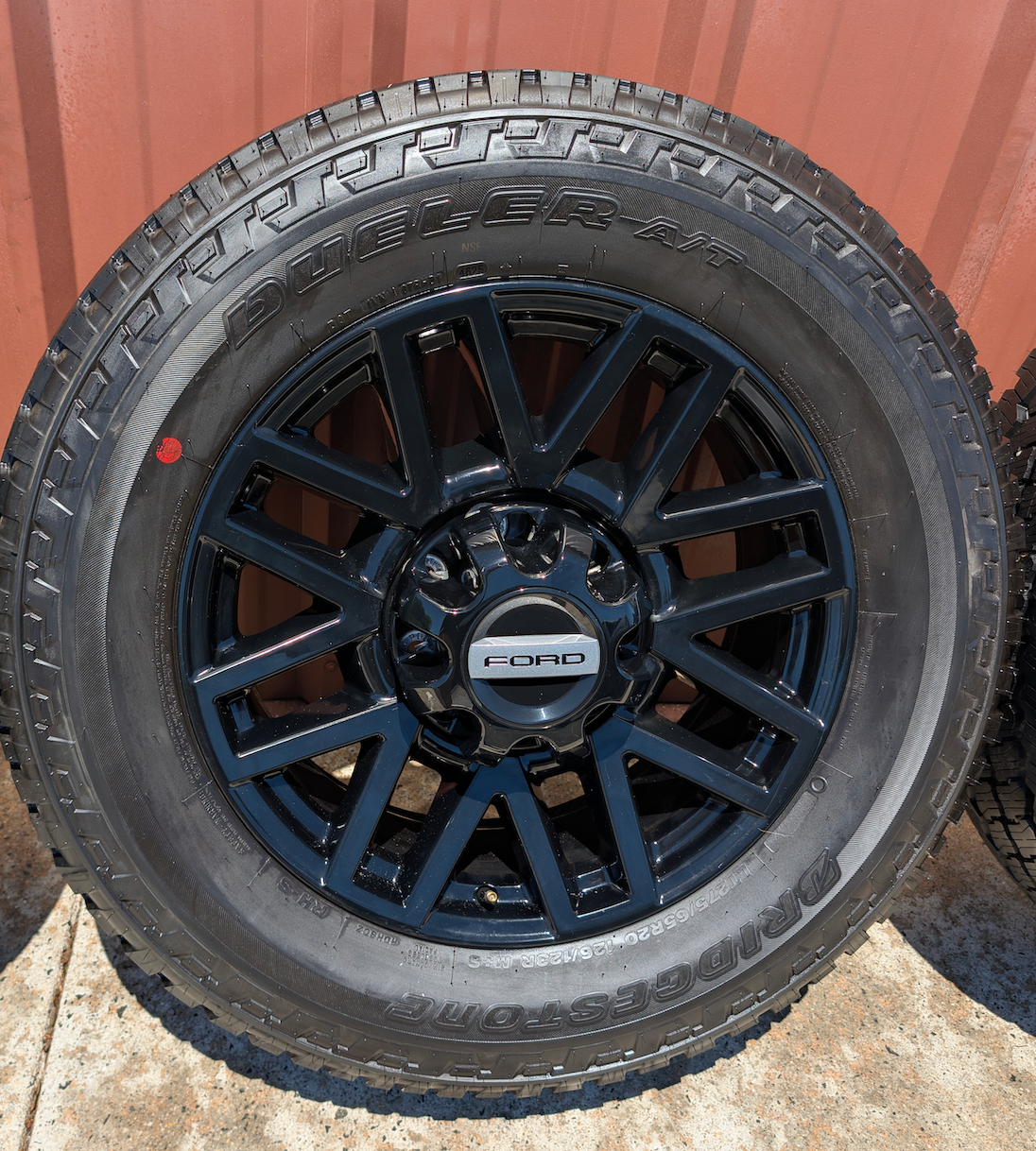 OEM 20” Chevrolet Silverado RST Gunmetal & Machined Wheels wrapped in Goodyear Wrangler TrailRunner A/T tires.