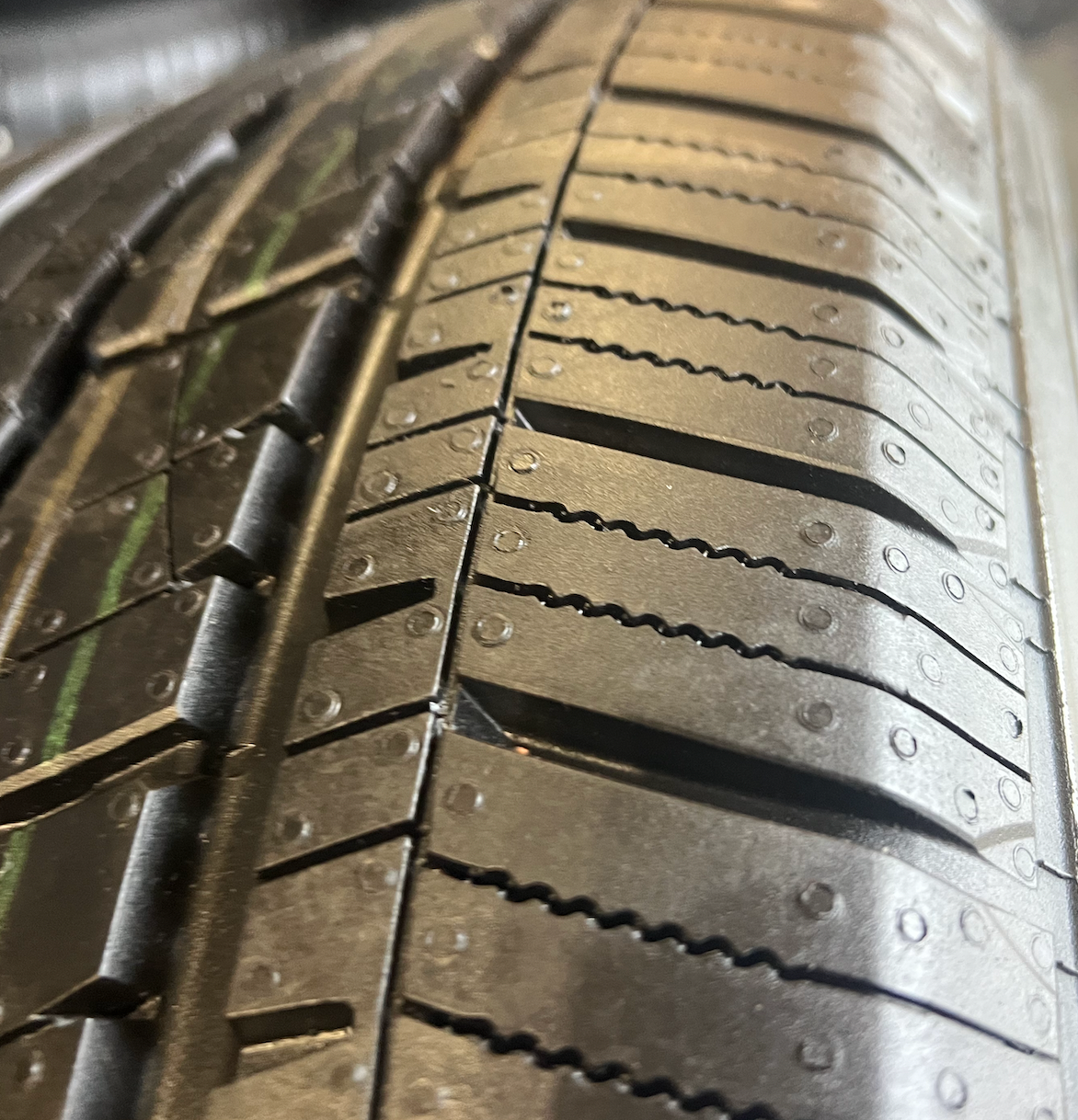 OEM 22” Gloss Black Wheels wrapped in General Grabber tires.