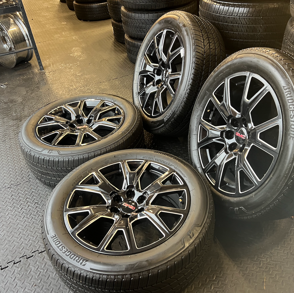 OEM 22” Gloss Black Machined Wheels wrapped in Bridgestone tires.