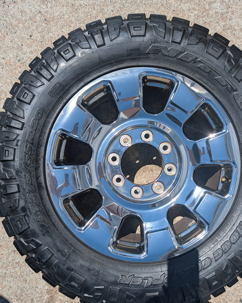 OEM 20” Chrome Ford F-250 / F-350 King Ranch / Lariat Wheels wrapped in LT275/65R20 Nitto Ridge Grappler tires.
