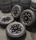 OEM 18” GMC Sierra 2500HD AT4X Black Wheels wrapped in Goodyear Wrangler Territory M/T tires.