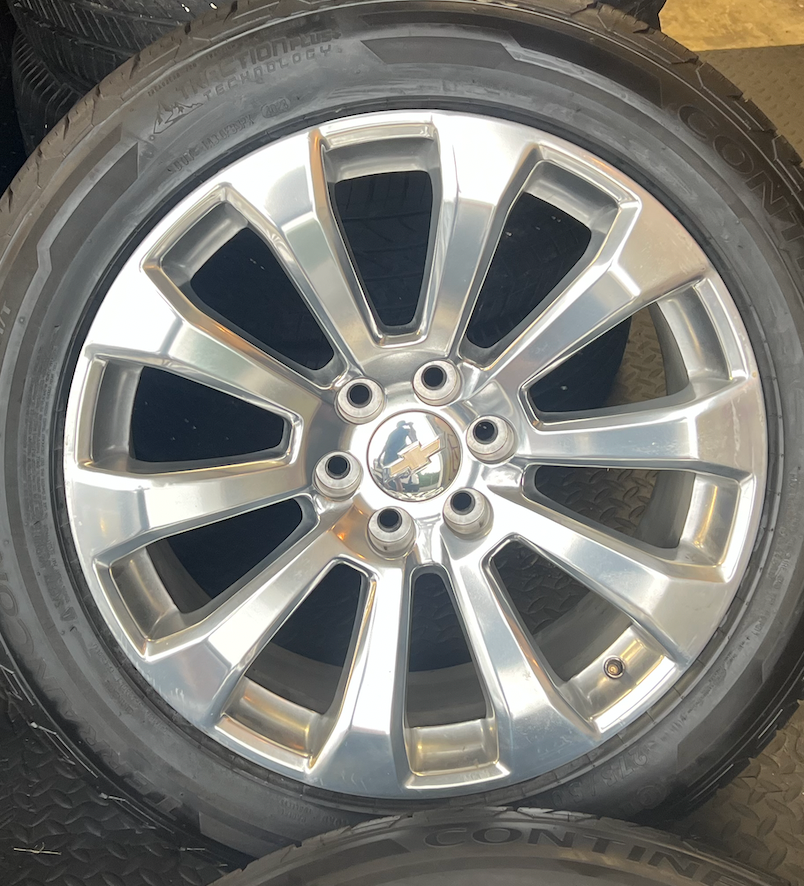 OEM 22”  High Country Polished Aluminum Wheels wrapped in Continental TerrainContact tires.