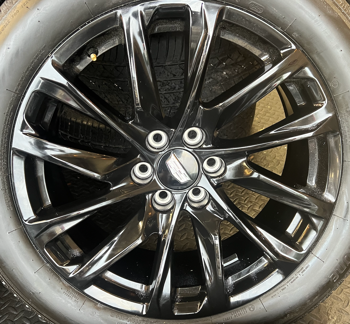 OEM 22” Gloss Black Wheels wrapped in Bridgestone tires.