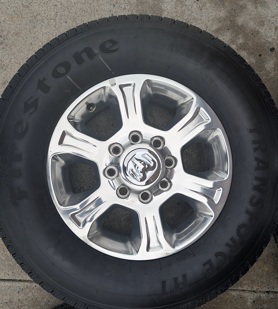 Polished Aluminum Ram 2500 / 3500 OEM 18” Wrapped in Firestone Transforce HT LT275/70R18