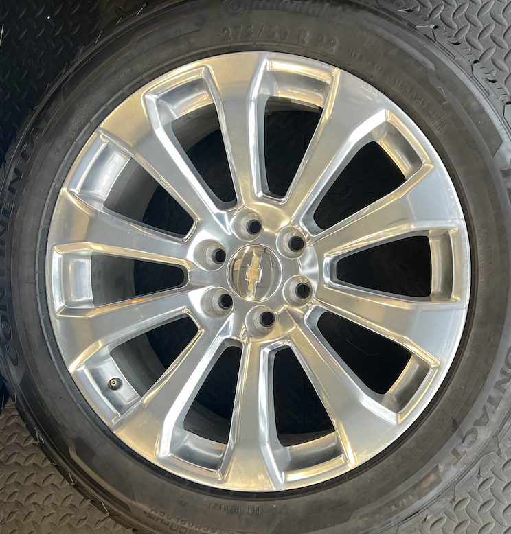 OEM 22”  High Country Polished Aluminum Wheels wrapped in Continental TerrainContact tires.