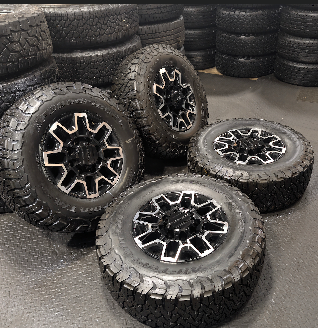 OEM 18” GMC Sierra 2500HD Wheels with Machined Black Finish wrapped in LT305/70R18 BFGoodrich All-Terrain T/A KO3 tires.