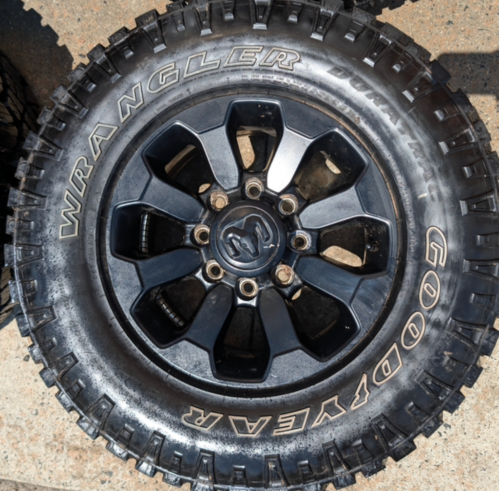 Matte Black Ram 2500 Power Wagon OEM 17” Wrapped in Goodyear Wrangler DuraTrac LT285/70R17