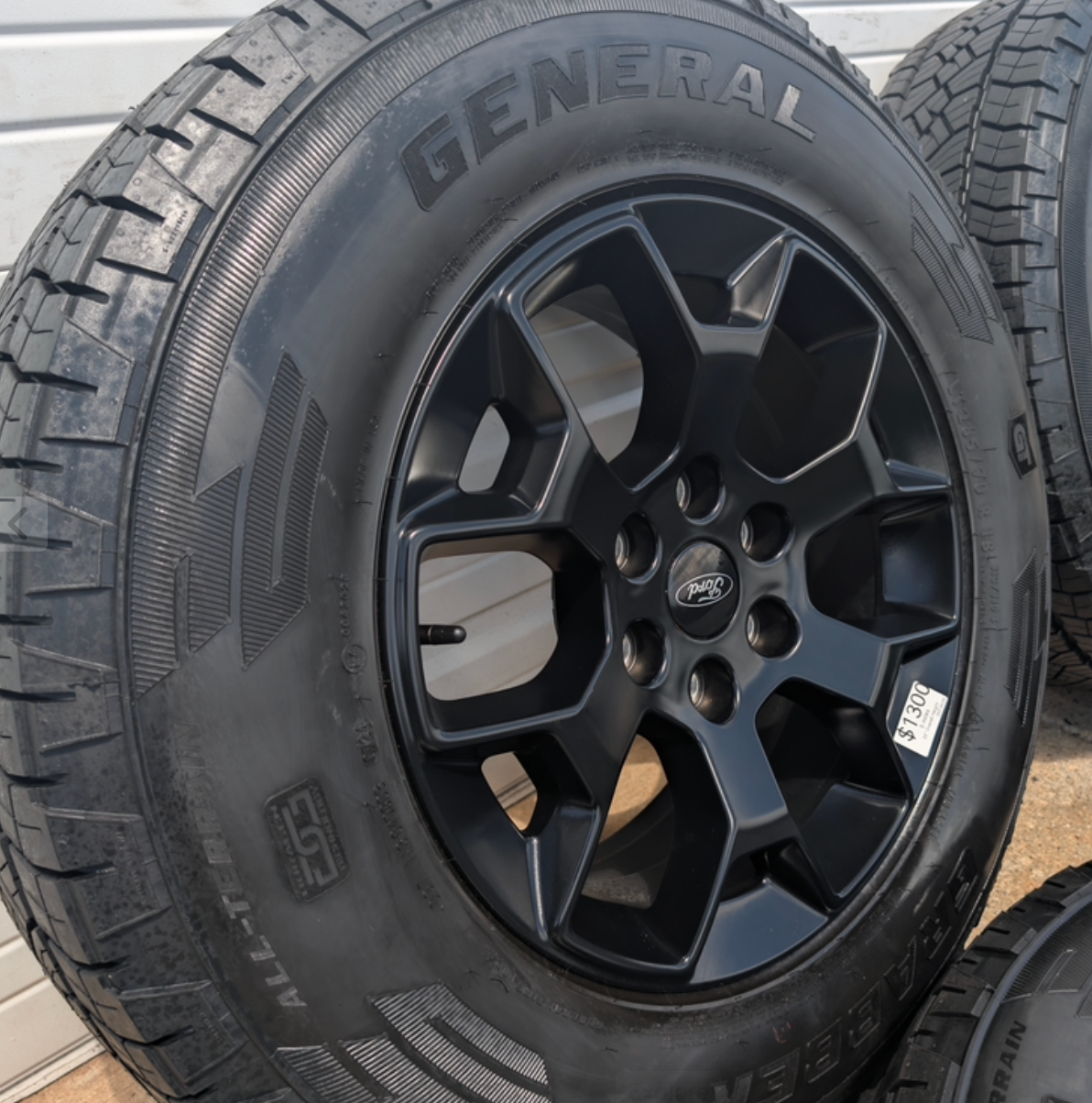 Matte Black Ford F-150 Tremor OEM 18” Wrapped in General Grabber APT LT265/70R18