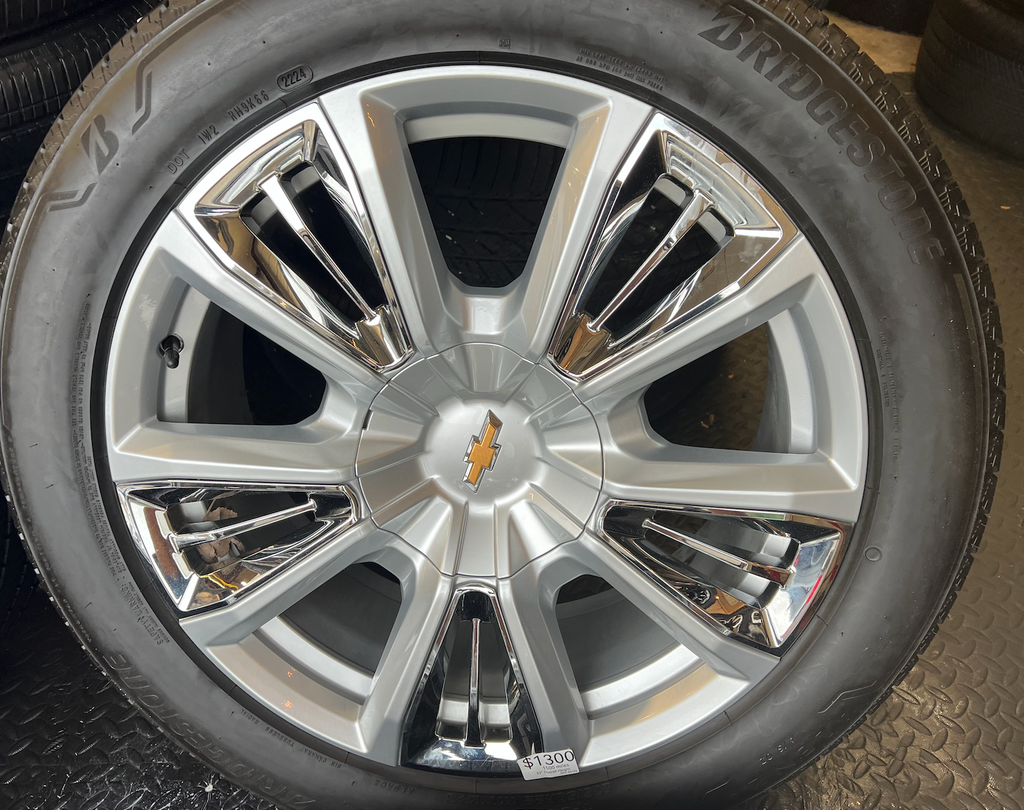 OEM 22” Chevrolet High Country Wheels wrapped in Bridgestone tires.