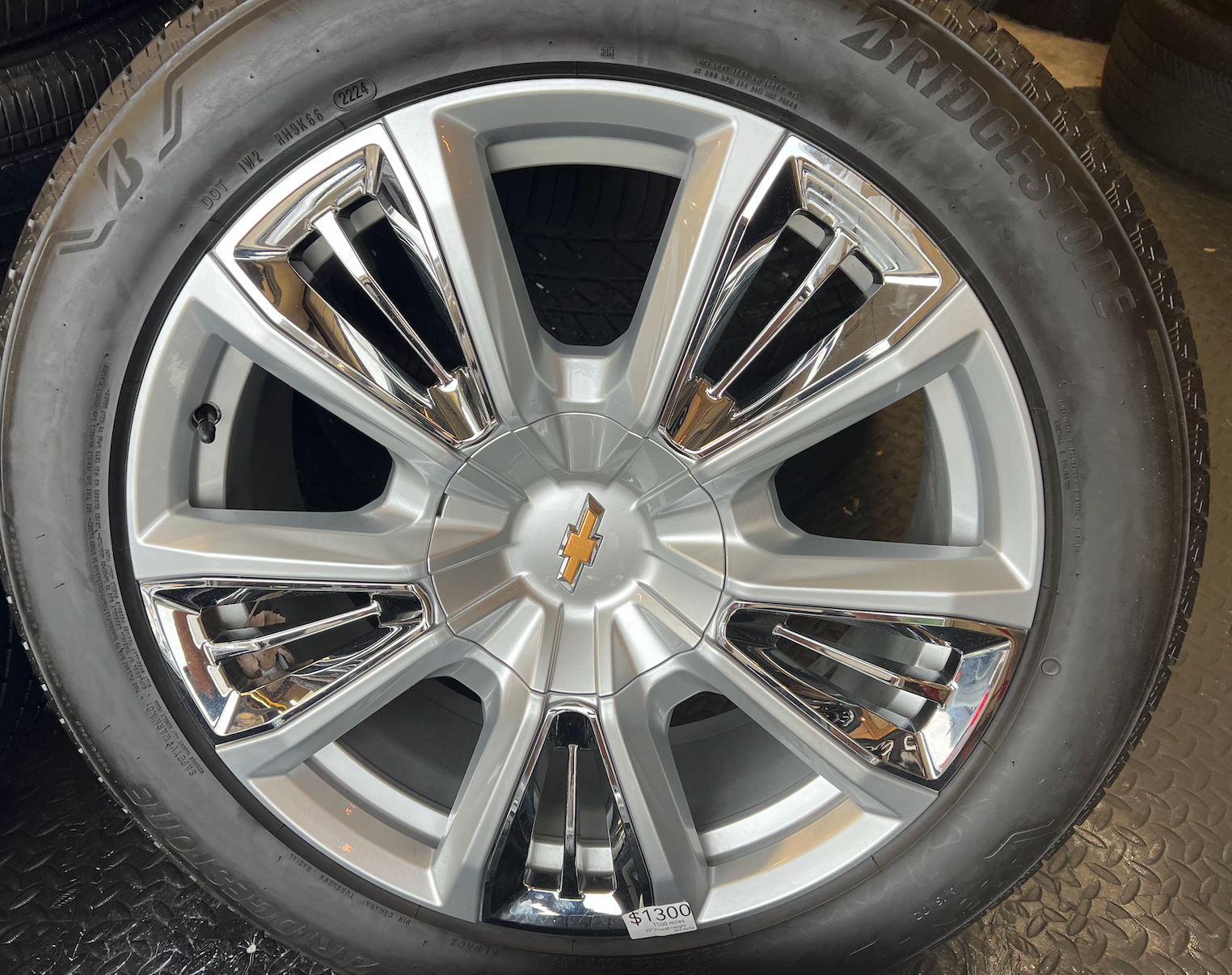 OEM 22” Chevrolet High Country Wheels wrapped in Bridgestone tires.