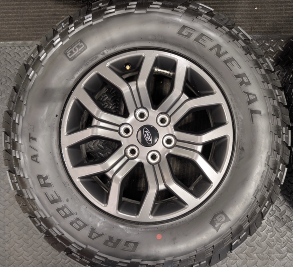 Gray Ford F-150 Tremor OEM 18” Wrapped in General Grabber A/TX 275/70R18