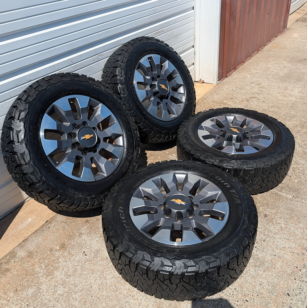 OEM 20” Chevrolet Silverado 2500HD / 3500HD Wheels with Machined Grey Finish wrapped in LT275/65R20 BFGoodrich All-Terrain T/A KO3 tires.