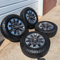 OEM 20” Chevrolet Silverado 2500HD / 3500HD Wheels with Machined Grey Finish wrapped in LT275/65R20 BFGoodrich All-Terrain T/A KO3 tires.