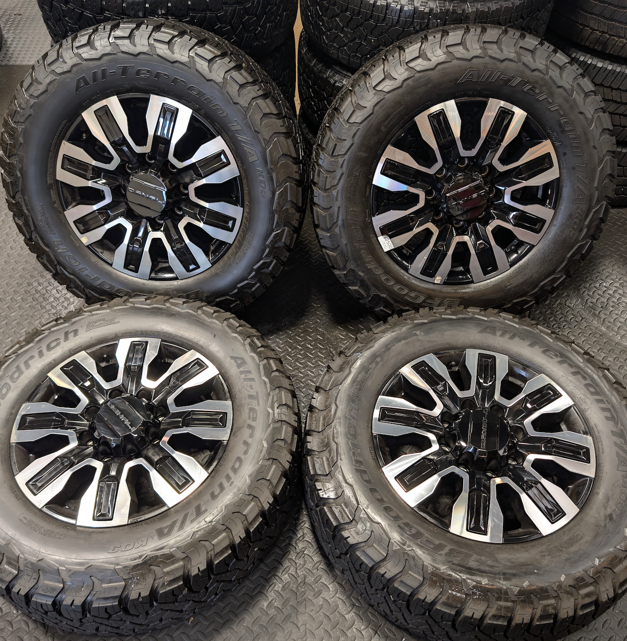 OEM 20” GMC Sierra Denali Ultimate 2500HD / 3500HD Machined Wheels wrapped in BFGoodrich All-Terrain T/A KO3 tires.