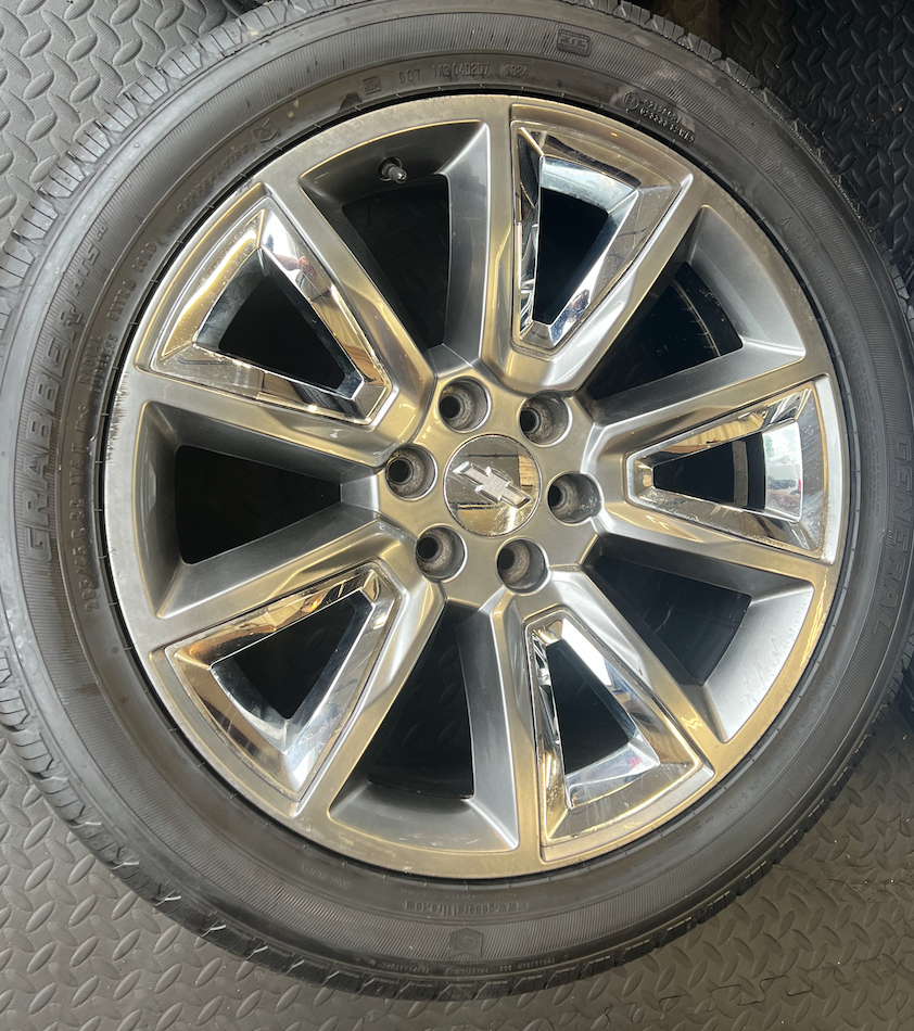 OEM 22” Wheels with Hypersilver Finish & Chrome Inserts wrapped in General Grabber tires.