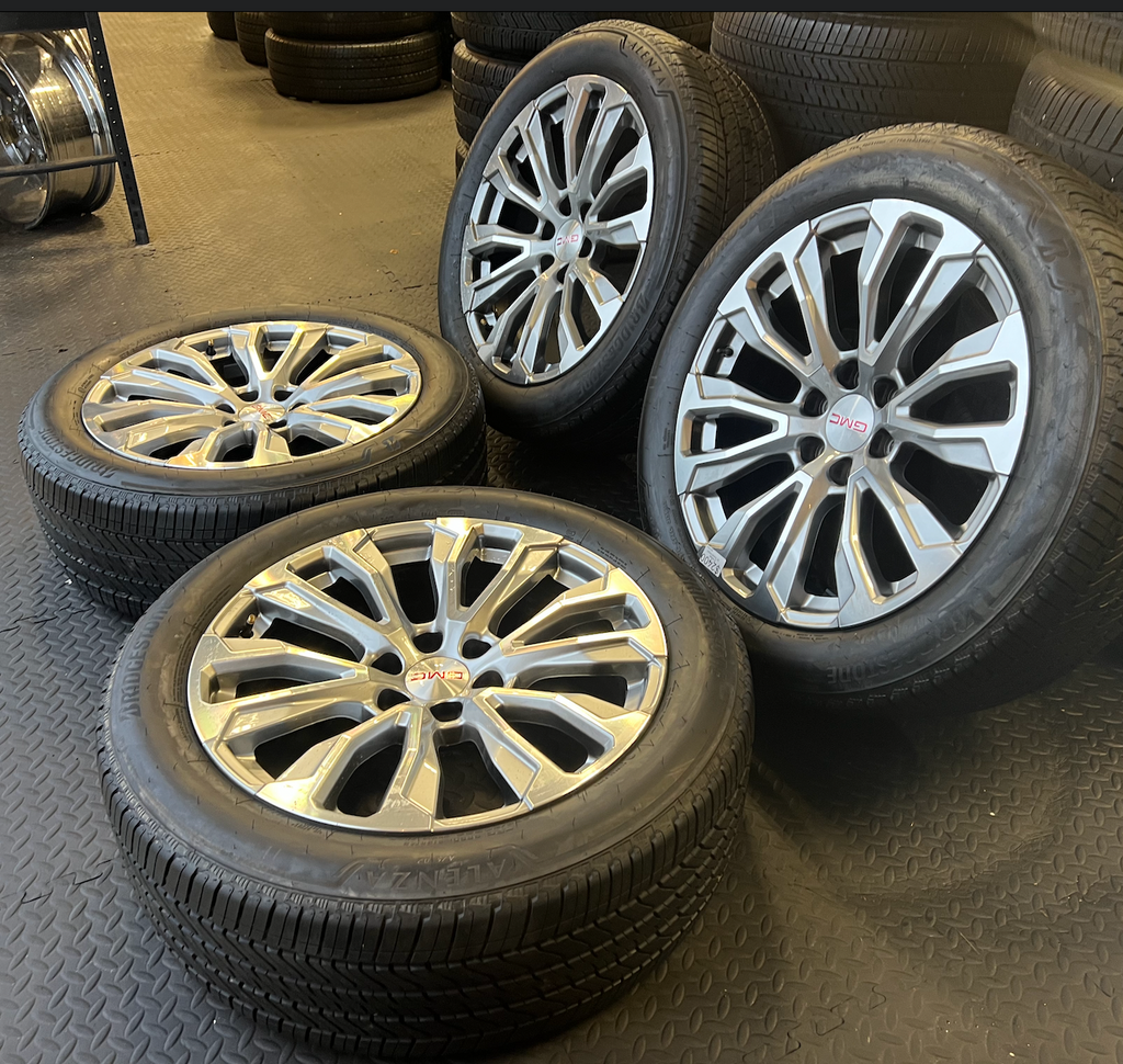 OEM 22” Denali Wheels with Machined & Grey Finish wrapped in Bridgestone tires.