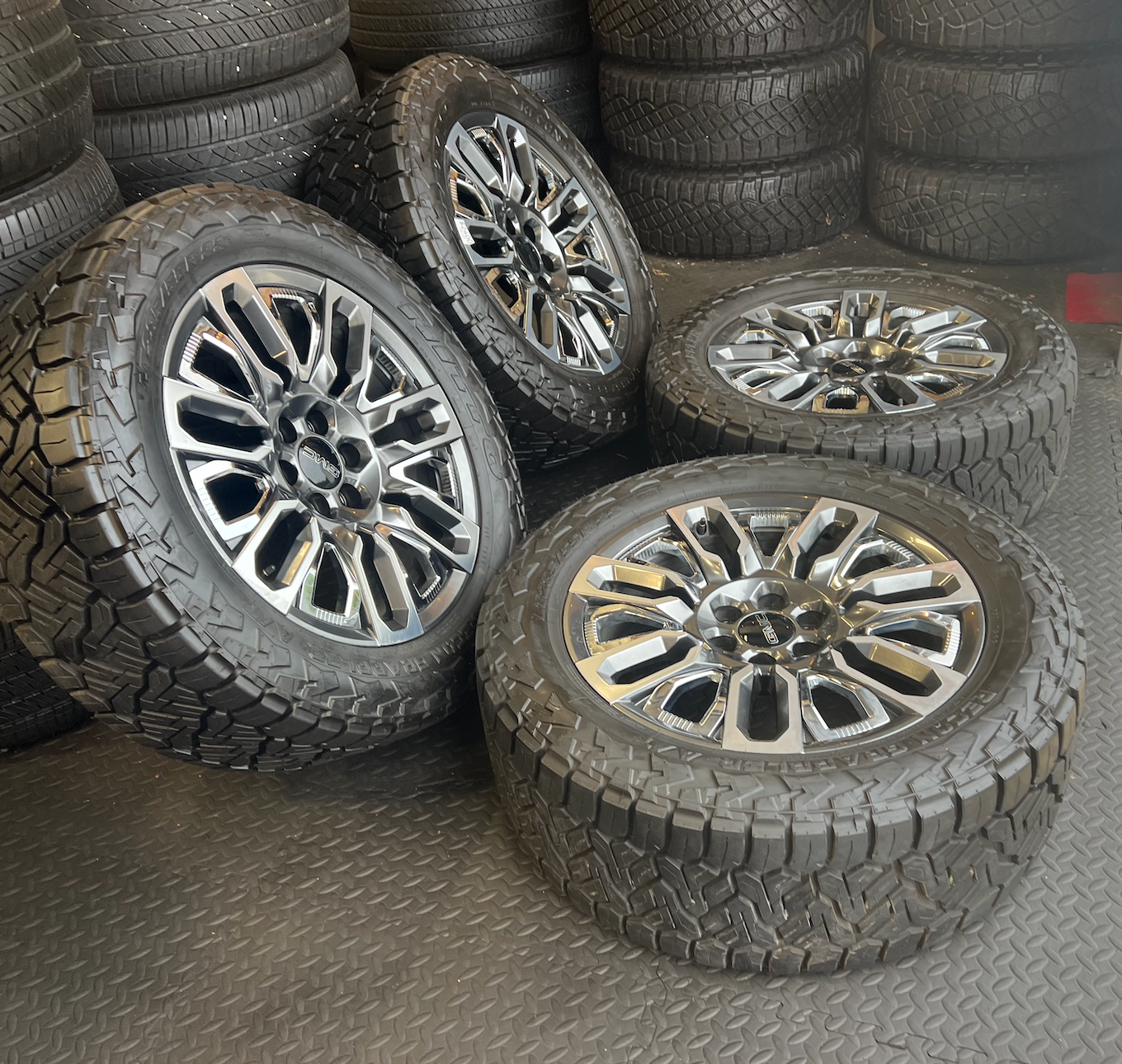 OEM 22”  Denali Ultimate Wheels with Charcoal Machined Finish & Chrome Inserts wrapped in Nitto Recon Grappler A/T tires.