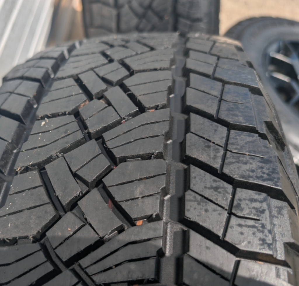 Matte Black Ford F-150 Tremor OEM 18” Wrapped in General Grabber APT LT265/70R18