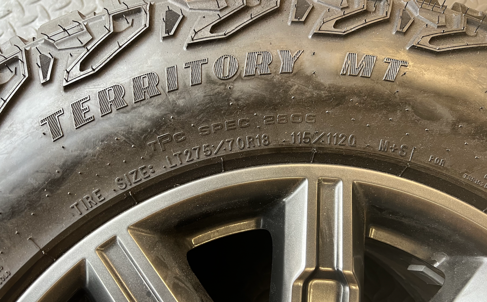 OEM 18" at4x machined aluminum Wheels wrapped in Goodyear tires.