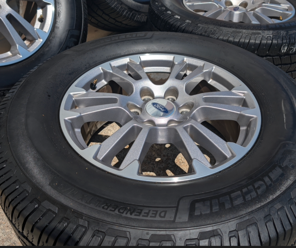 Gray Machined Ford F-150 Lariat OEM 18” Wrapped in Michelin Defender LTX 275/65R18