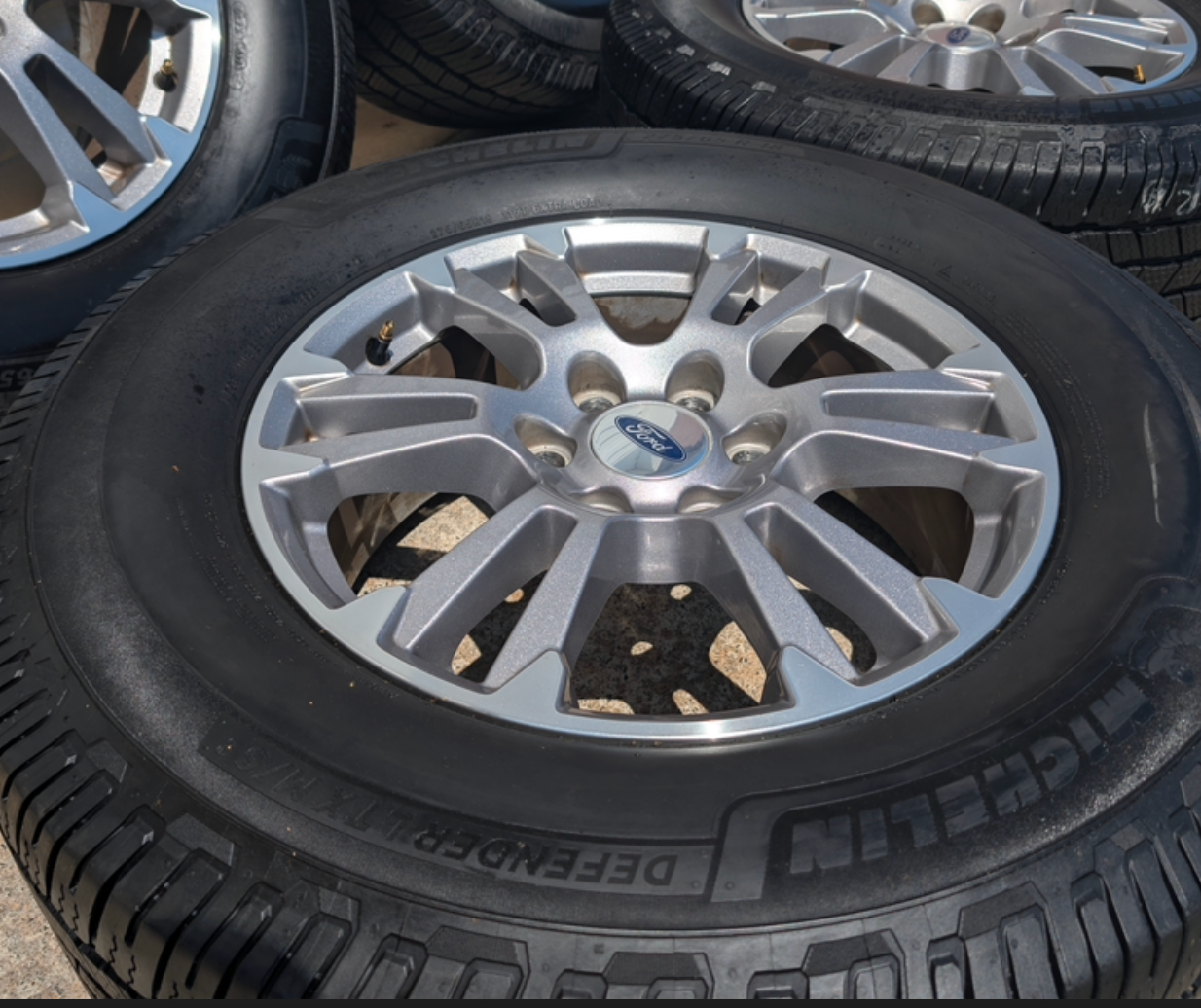 Gray Machined Ford F-150 Lariat OEM 18” Wrapped in Michelin Defender LTX 275/65R18