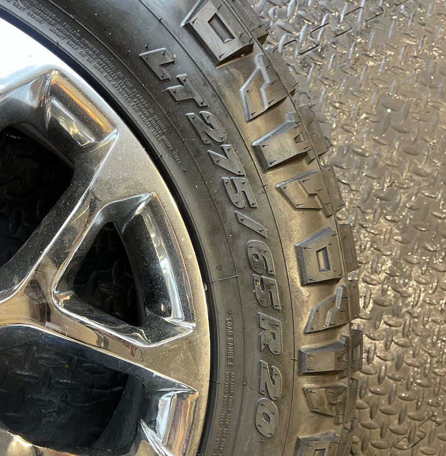 OEM 20” Chrome Truck Wheels wrapped in Nitto Ridge Grappler tires.
