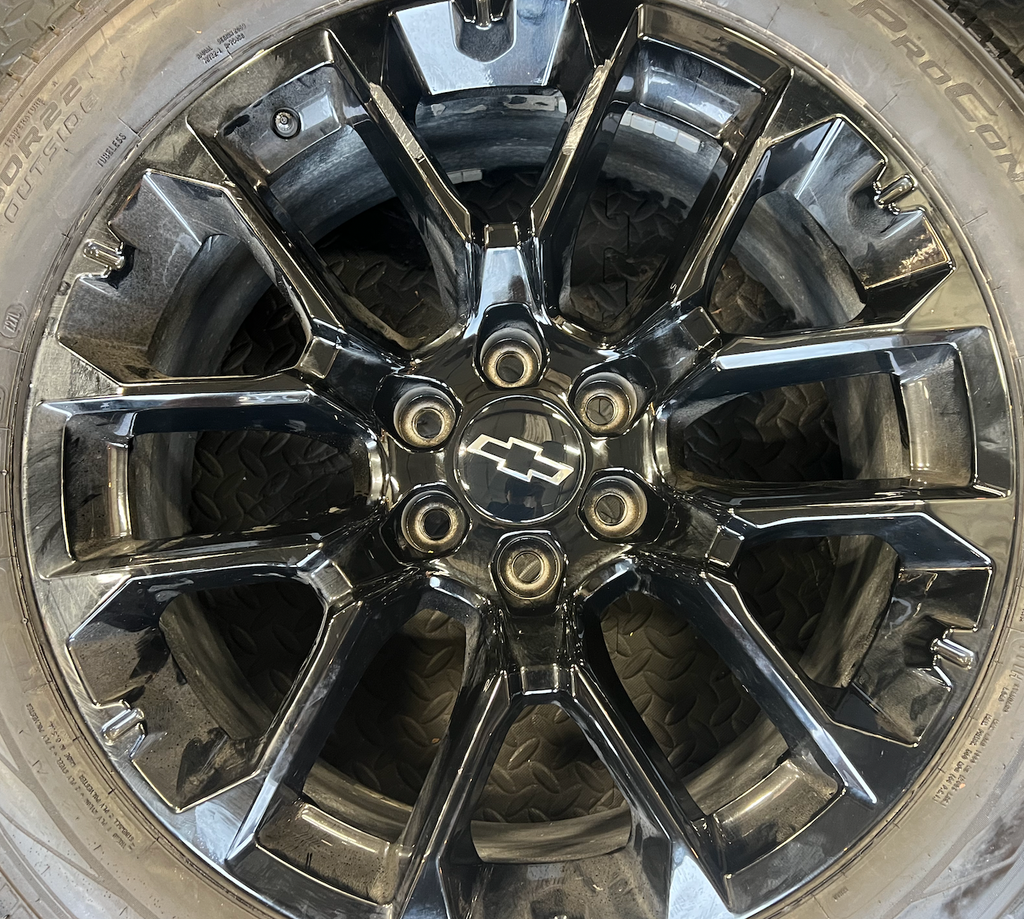 OEM 22” Gloss Black Chevrolet Wheels wrapped in Cooper ProControl tires.