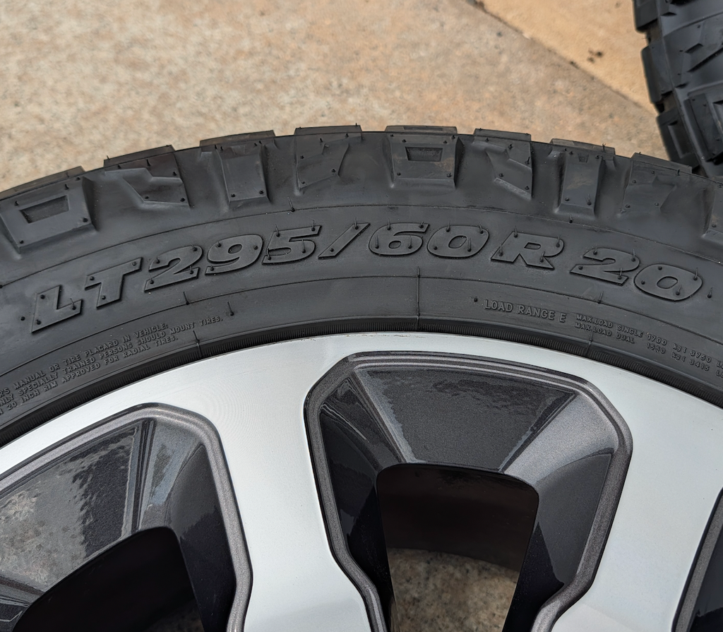 Machined Ram 2500 / 3500 OEM 20” Wrapped in Nitto Ridge Grappler LT295/60R20