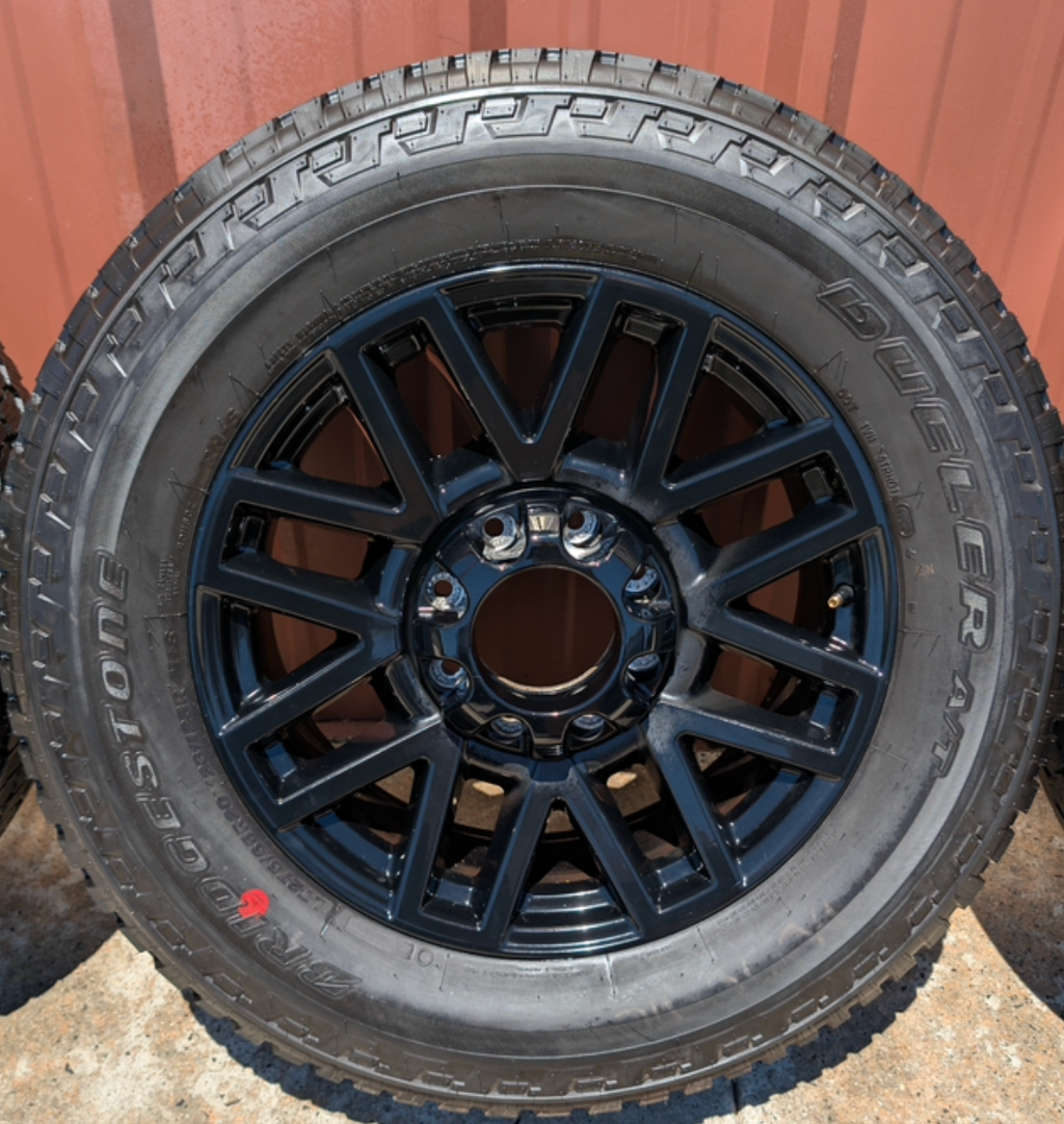 OEM 20” Chevrolet Silverado RST Gunmetal & Machined Wheels wrapped in Goodyear Wrangler TrailRunner A/T tires.