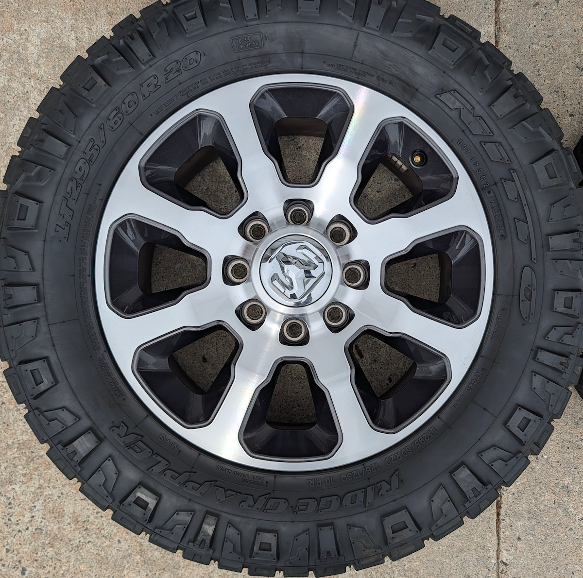 Machined Ram 2500 / 3500 OEM 20” Wrapped in Nitto Ridge Grappler LT295/60R20
