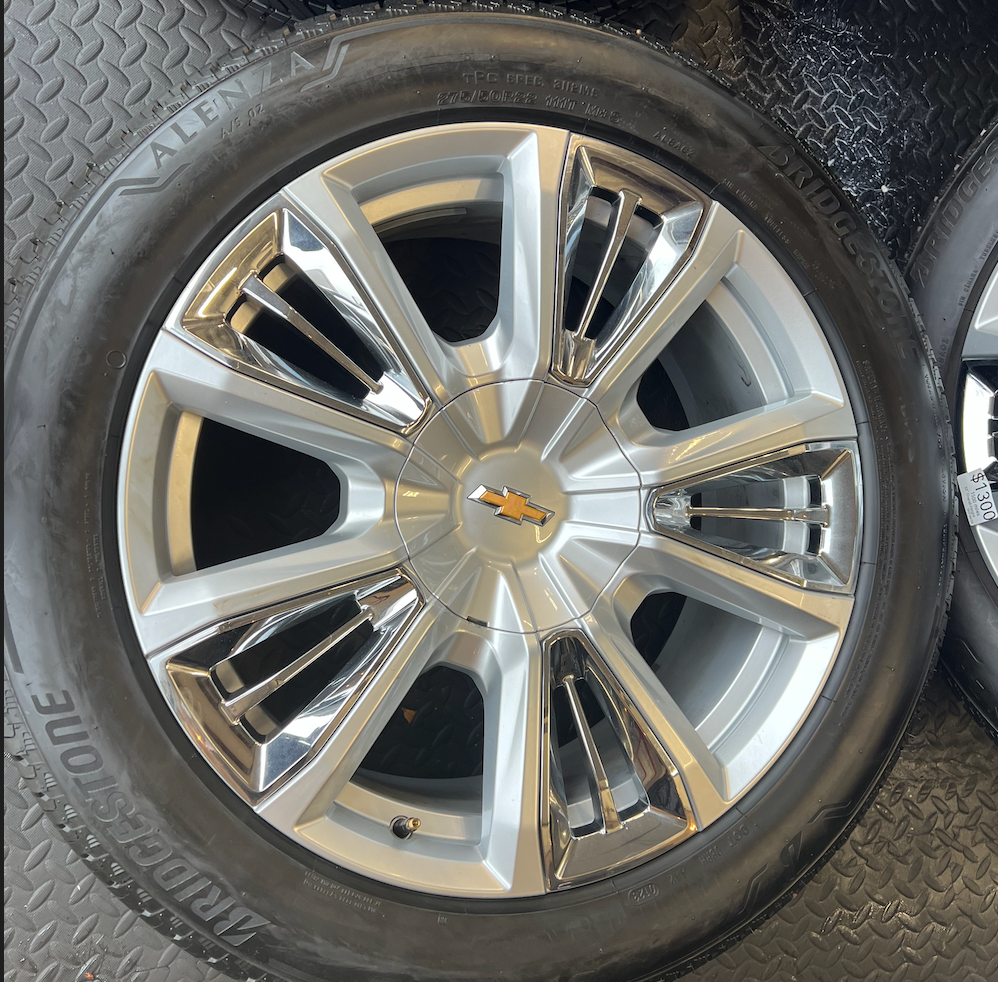 OEM 22” Chevrolet High Country Wheels wrapped in Bridgestone tires.