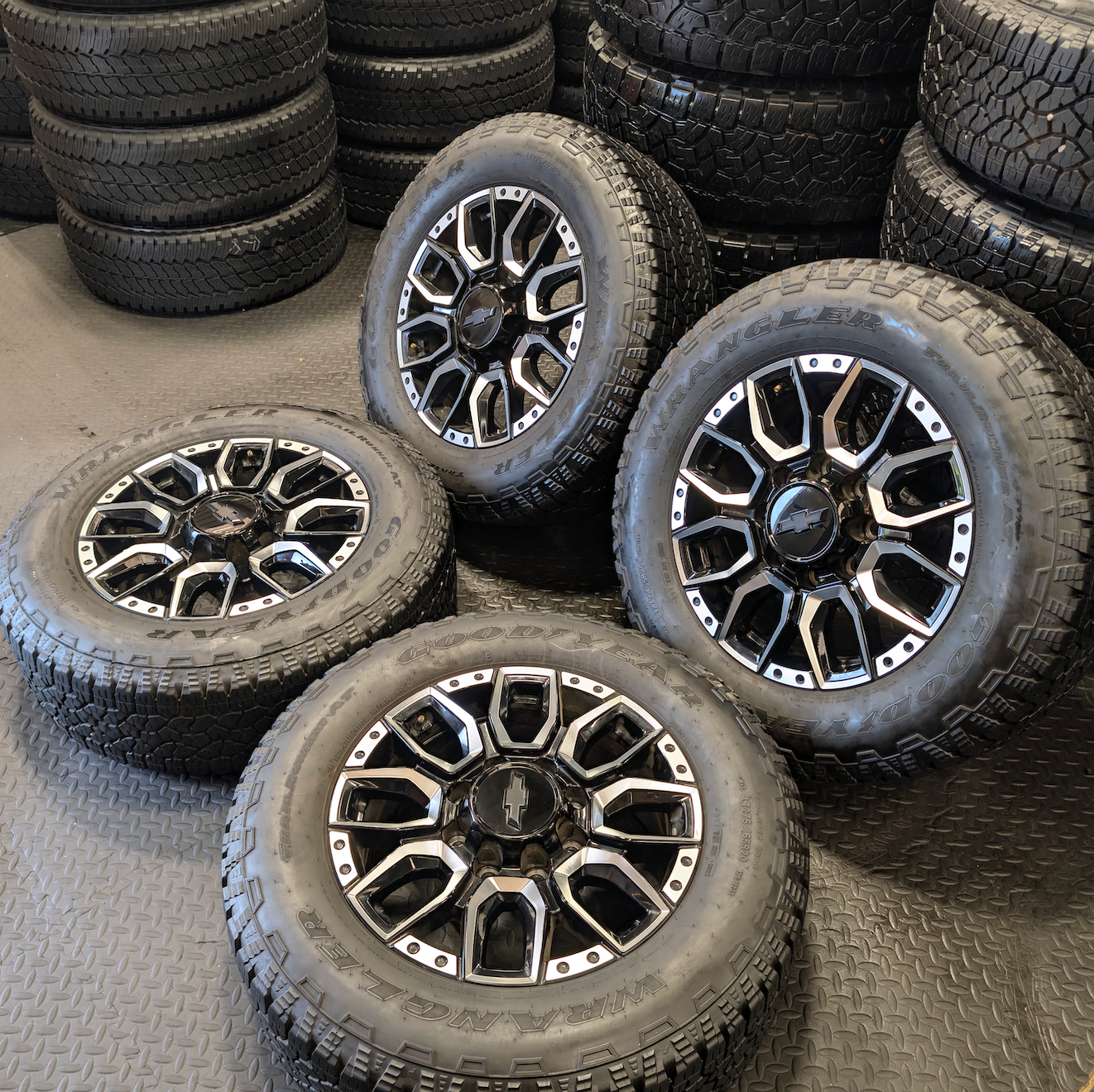 OEM 20” Machined GM 2500HD / 3500HD Wheels wrapped in Goodyear Wrangler TrailRunner A/T tires.
