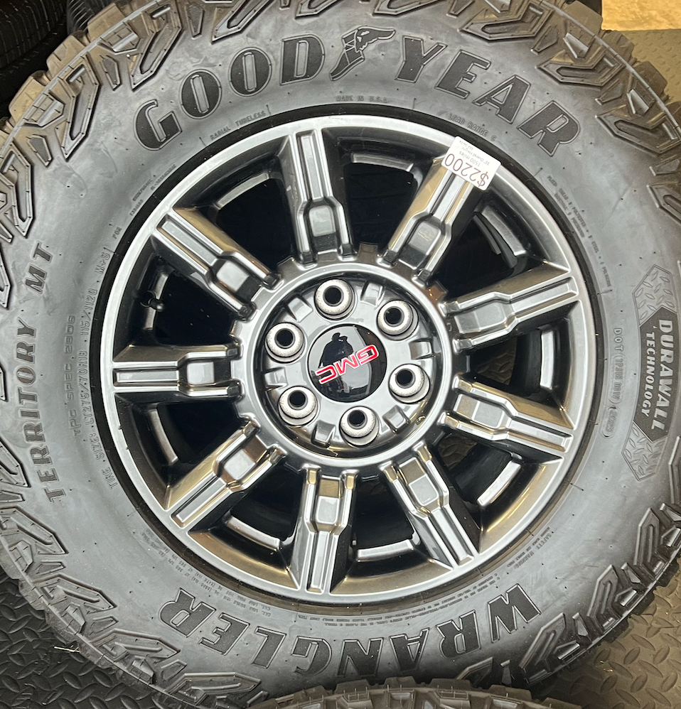 OEM 18” AT4X machined aluminum Wheels wrapped in Goodyear Wrangler Territory M/T tires.
