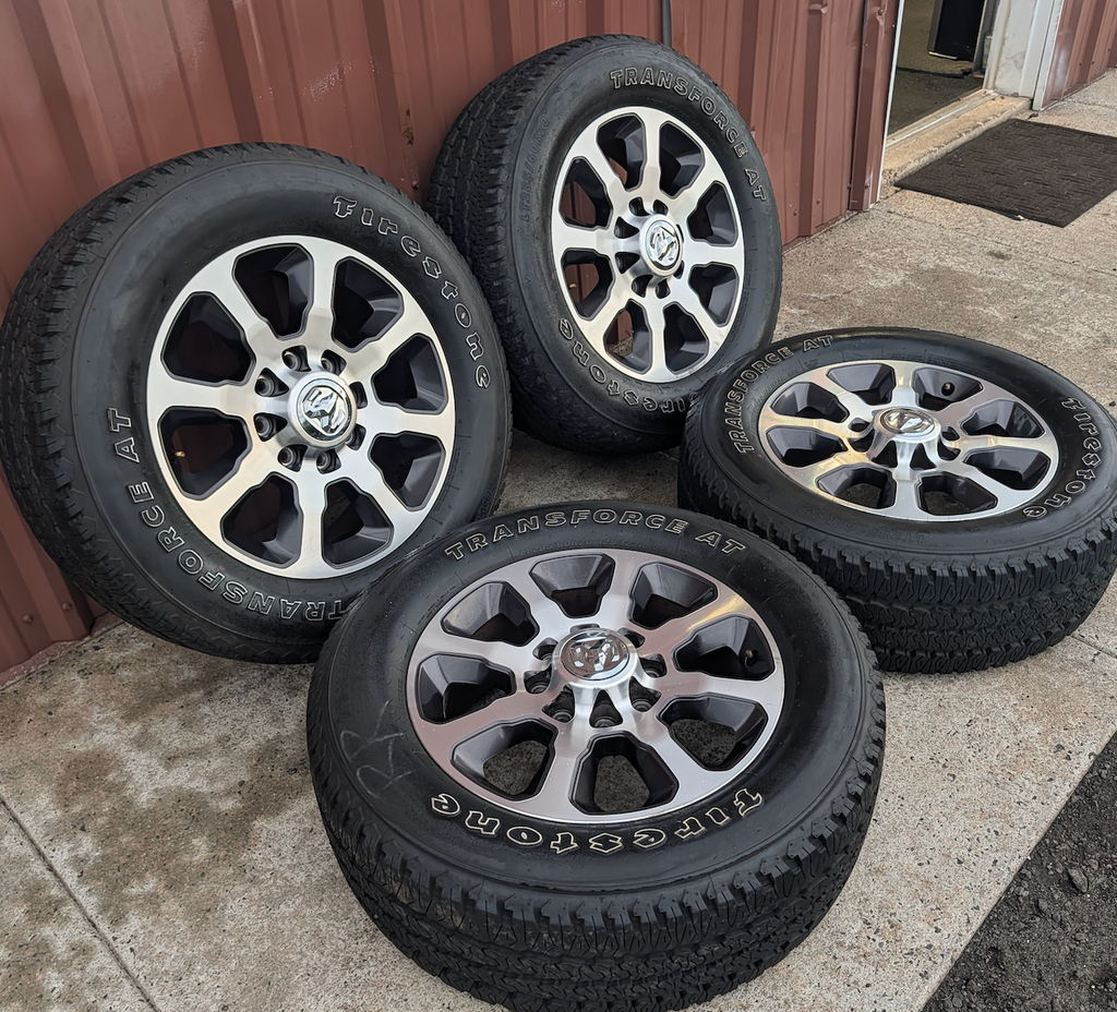 Machined 2500 / 3500 Laramie Longhorn OEM 20” Wrapped in Firestone Transforce A/T LT285/60R20