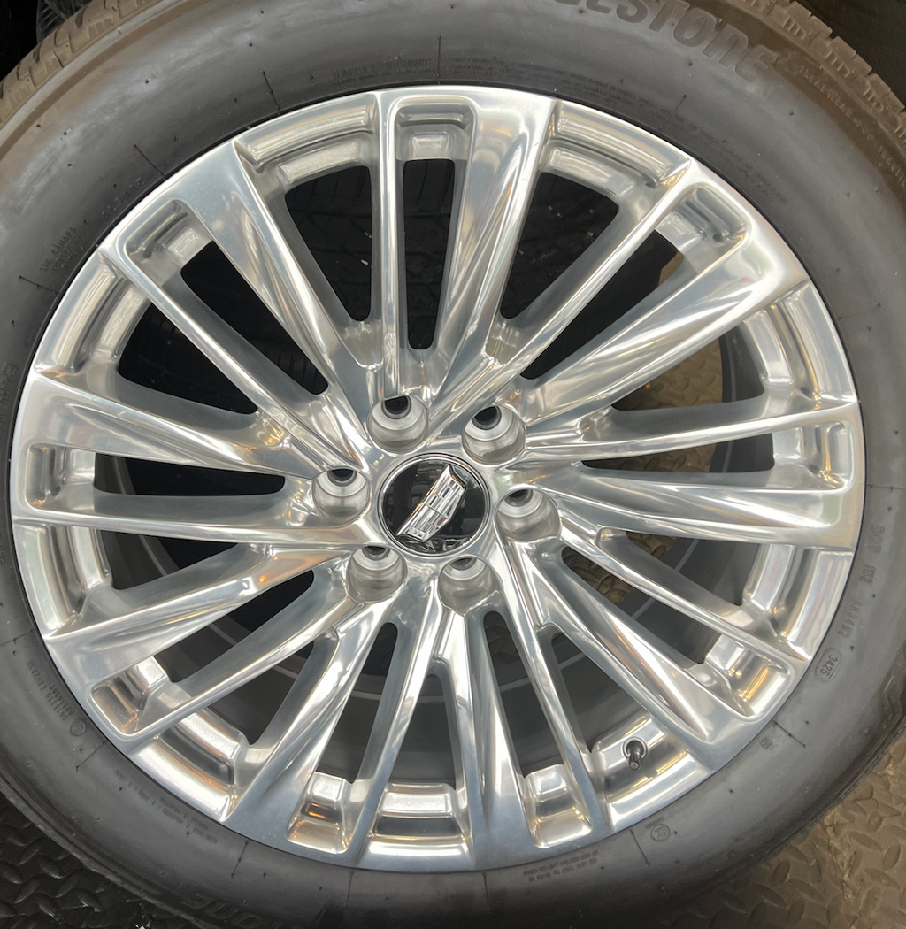OEM 22” Polished Aluminum Wheels wrapped in Bridgestone tires.