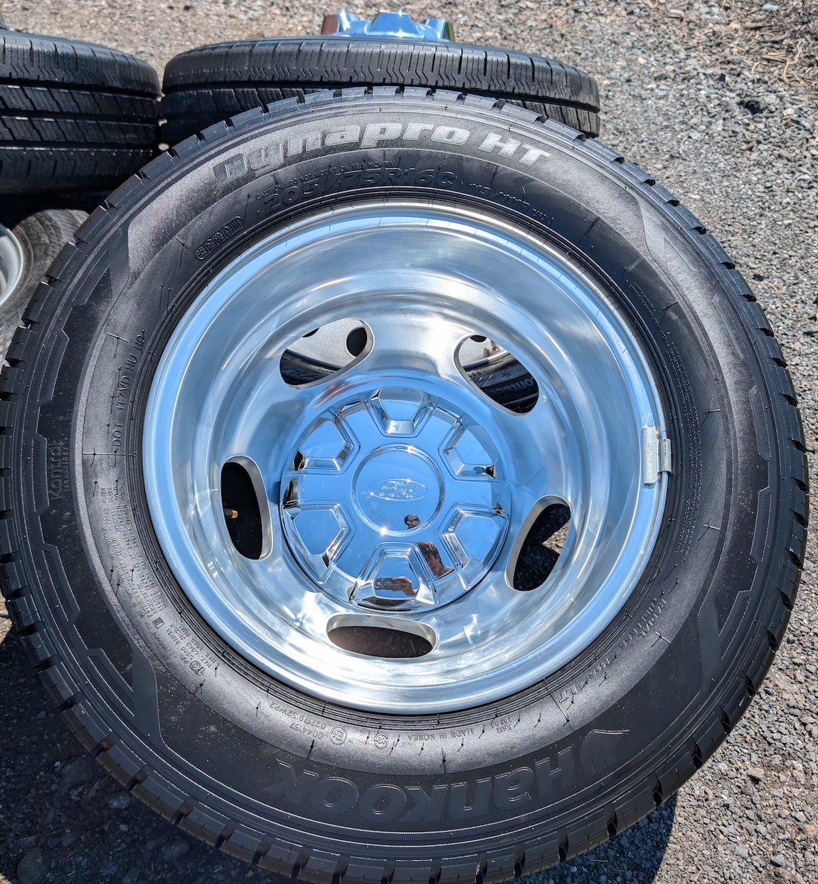 OEM 16” Polished Ford Transit Dual Rear Wheel (Dually) Wheels wrapped in 205/75R16 Hankook Dynapro HT tires.