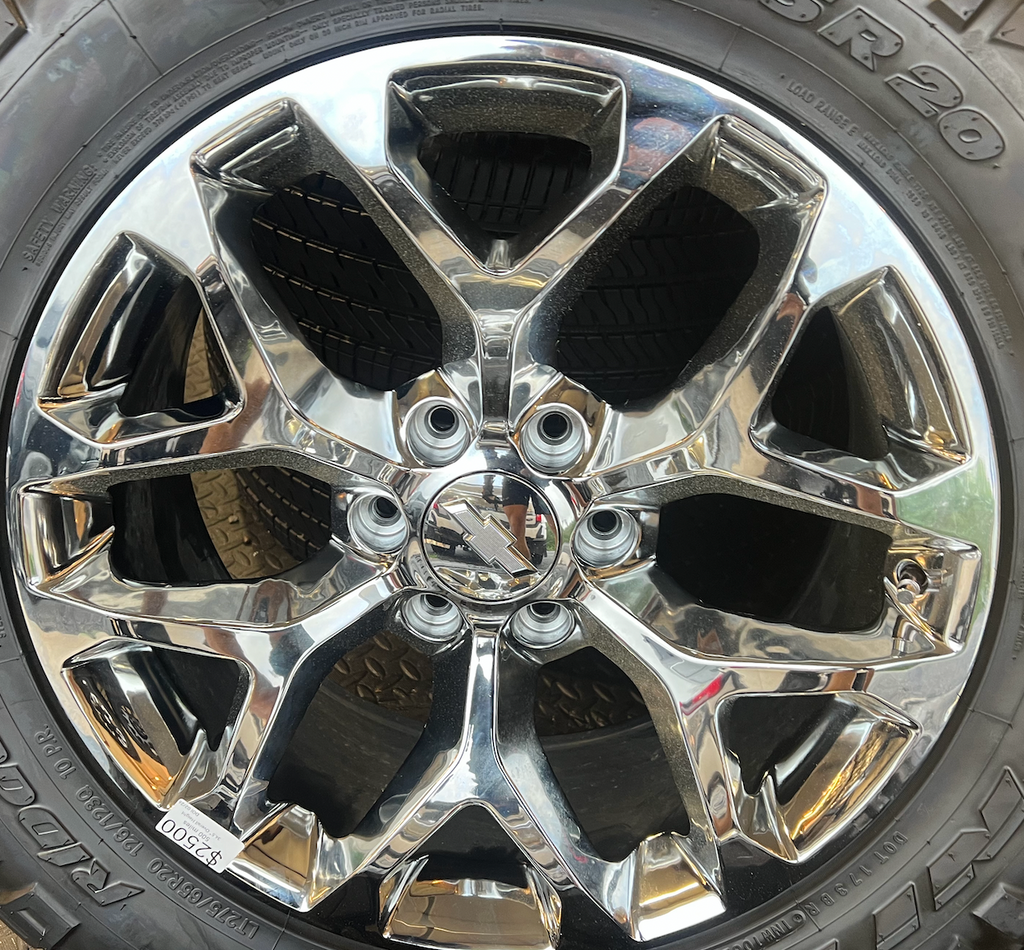 OEM 20” Chrome Truck Wheels wrapped in Nitto Ridge Grappler tires.