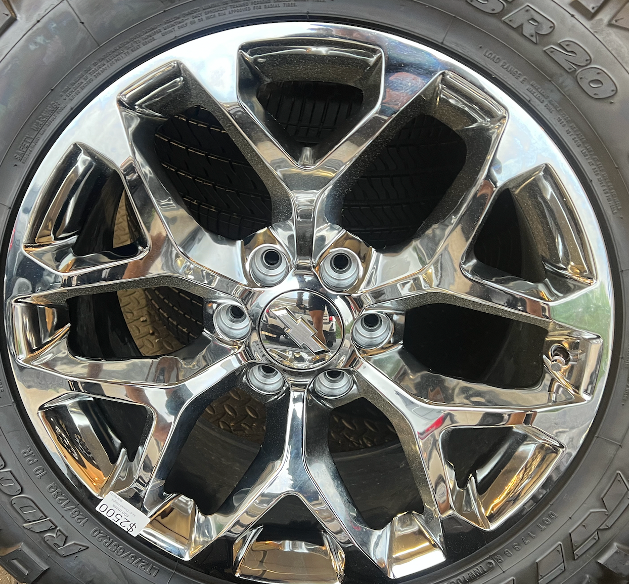 OEM 20” Chrome Truck Wheels wrapped in Nitto Ridge Grappler tires.