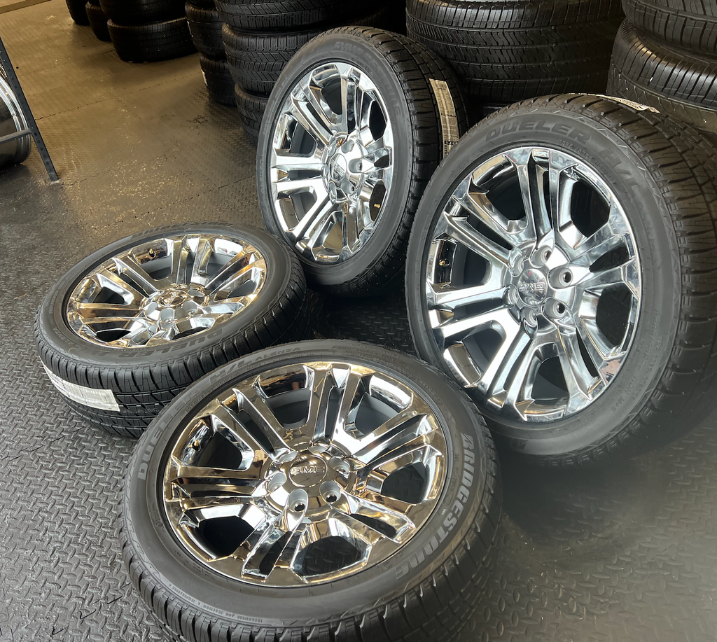 OEM 22” Split 6 Chrome Wheels wrapped in Bridgestone Dueler H/L Alenza tires.