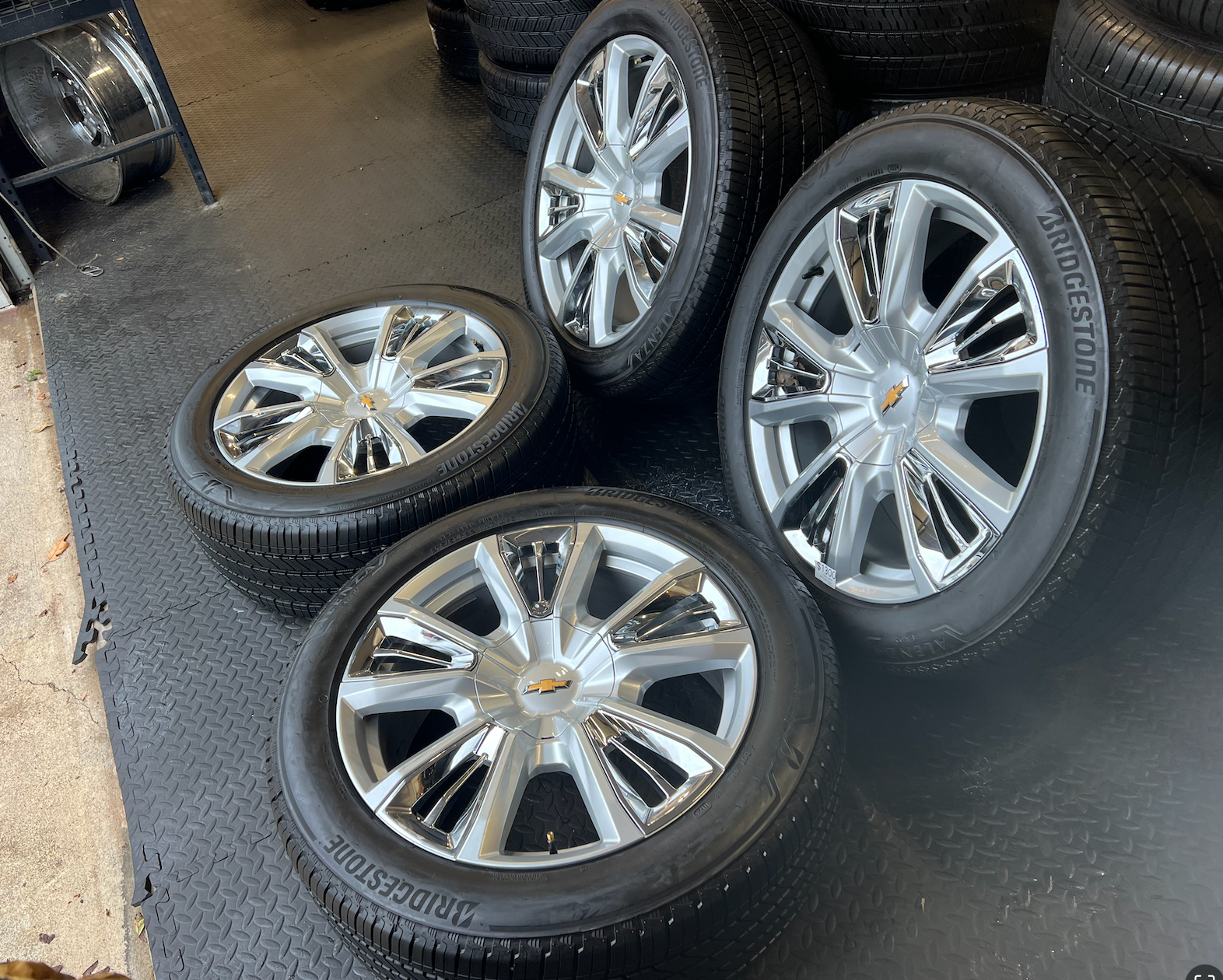 OEM 22” Chevrolet High Country Wheels wrapped in Bridgestone tires.