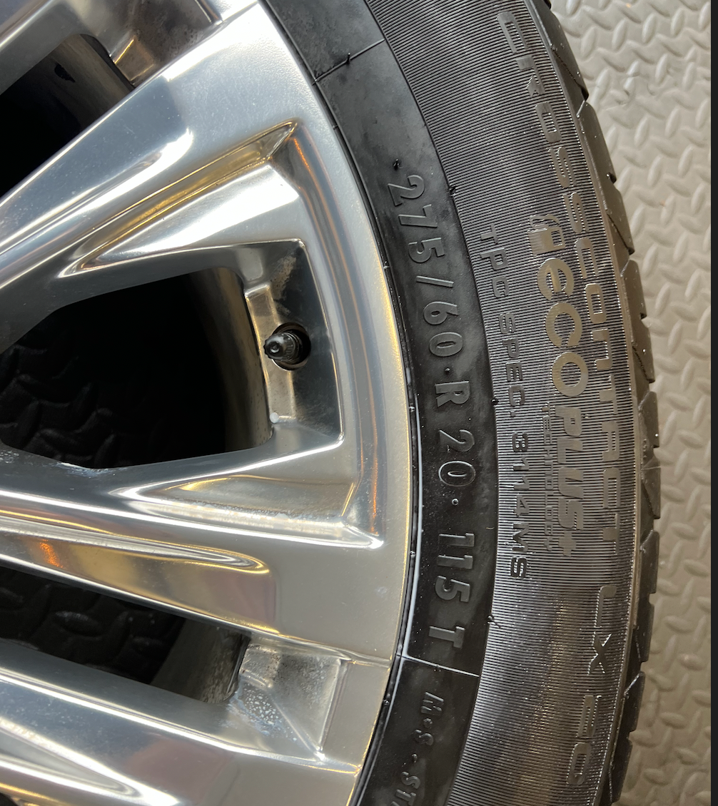 OEM 20” Polished Wheels wrapped in 20” Continental tires.