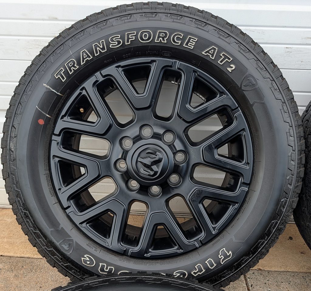 Matte Black Ram 2500 / 3500 OEM 20” Wrapped in Firestone Transforce AT2 LT285/60R20